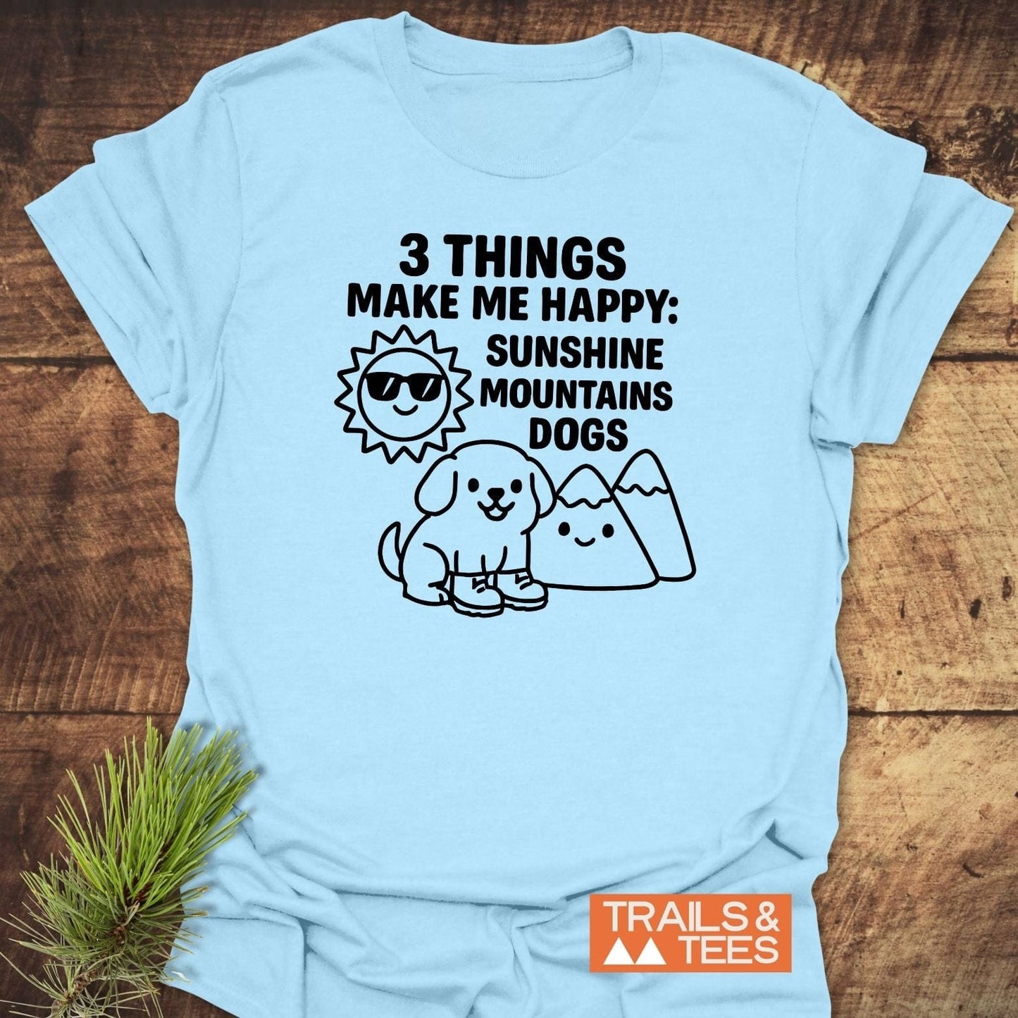 Sunshine Mountains Dogs T-Shirt featuring playful sun, mountain, and dog illustrations. Crafted from soft cotton for outdoor enthusiasts, with durable prints and no side seams.