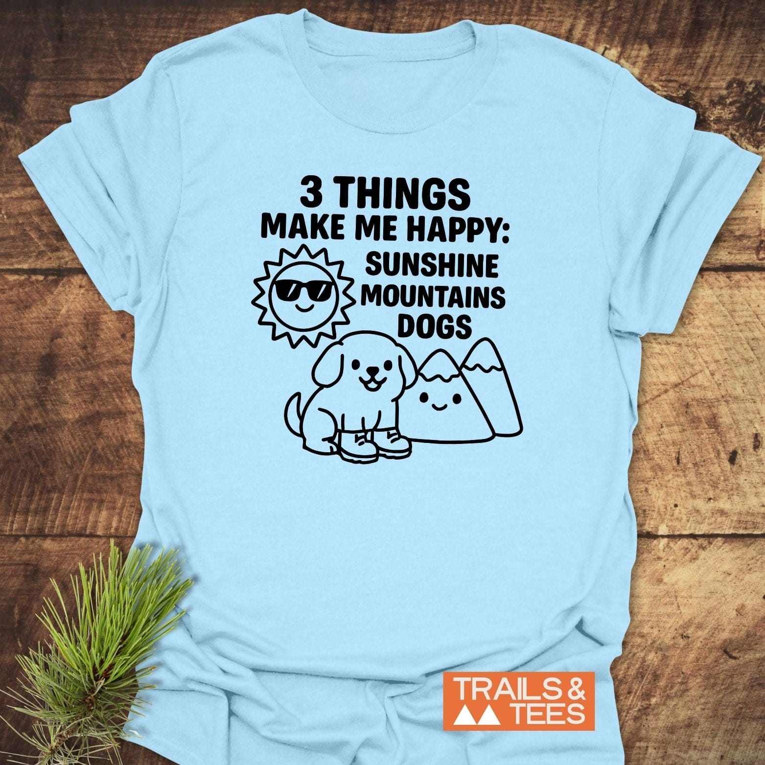 Sunshine Mountains Dogs T-Shirt featuring playful sun, mountain, and dog illustrations. Crafted from soft cotton for outdoor enthusiasts, with durable prints and no side seams.
