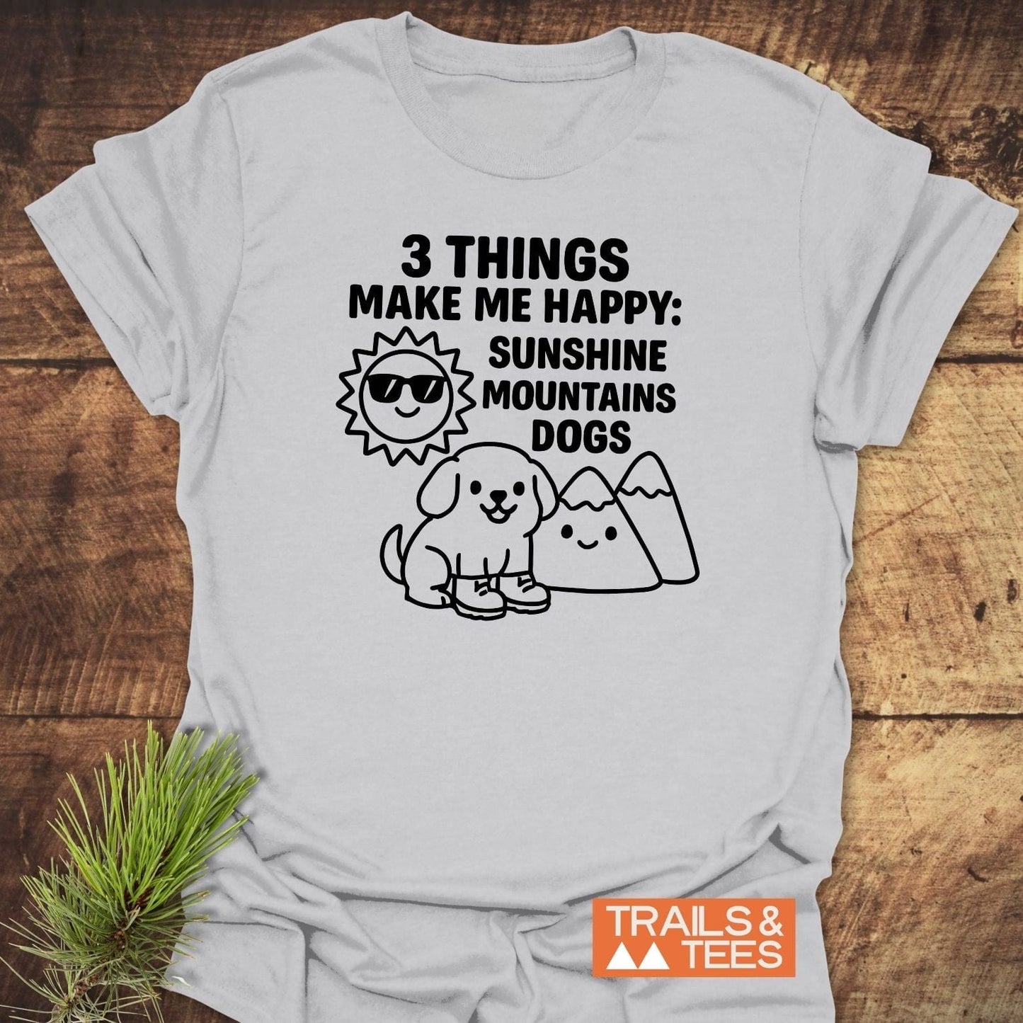 Sunshine Mountains Dogs T-Shirt featuring bold black text and playful drawings on white cotton, embodying outdoor adventure spirit with durable, fade-resistant prints.