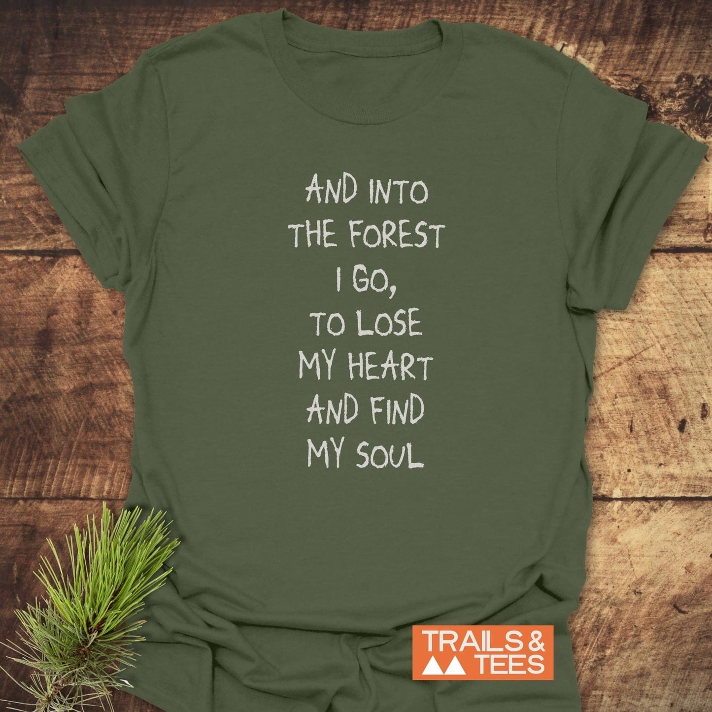 And Into The Forest I Go T-Shirt with white slogan, laid flat. Soft, lightweight cotton, ideal for outdoor enthusiasts, by Trails & Tees.
