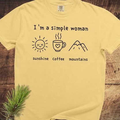 I'm A Simple Woman Comfort Colors 1717 Tee with icons of sun, coffee, mountains; soft, relaxed fit, 100% ring-spun cotton, durable stitching.