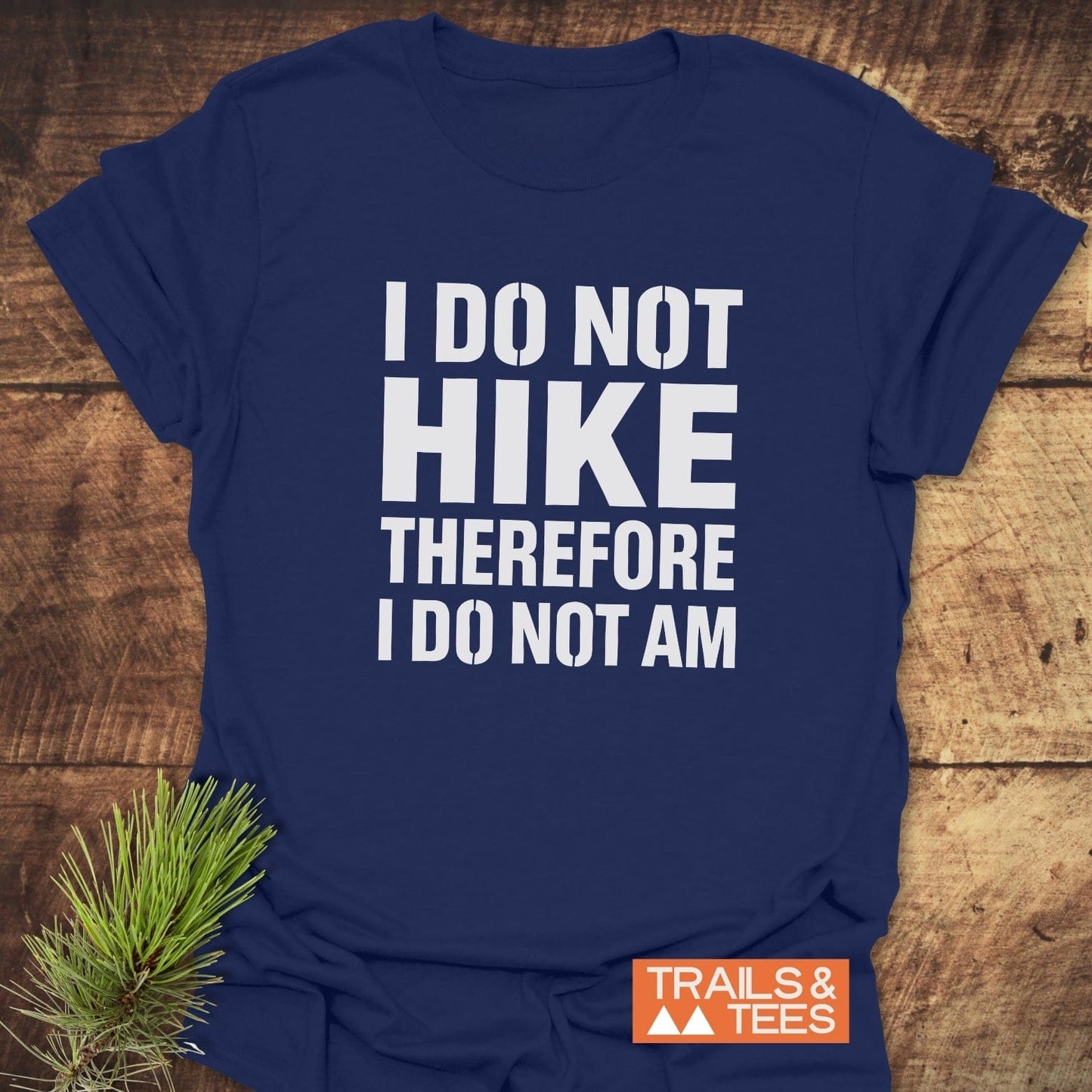Navy-blue I Do Not Hike Funny T-Shirt with bold white lettering, orange TRAILS & TEES logo, and pine sprig; crafted for comfort and durability.