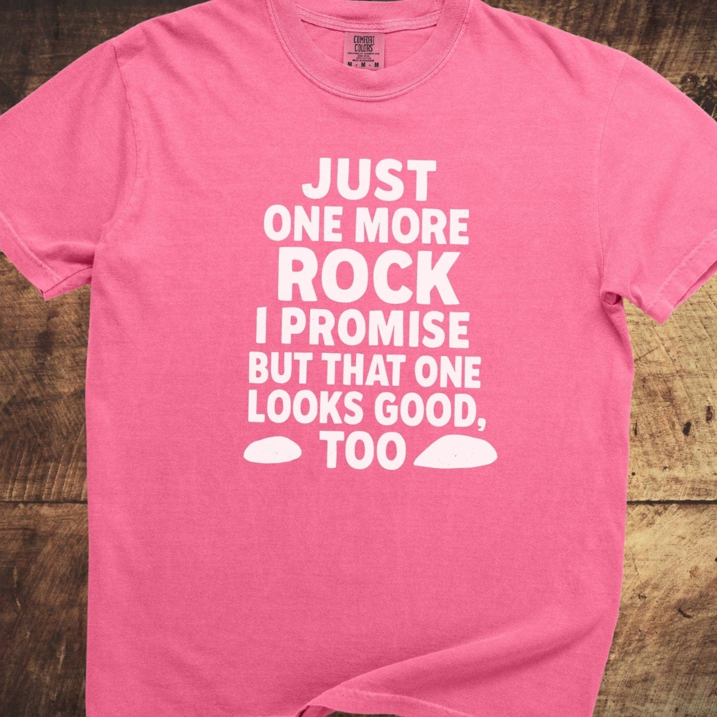 Just One More Rock Funny Comfort Colors 1717 Tee on wood, pink with white text and stone graphics, soft garment-dyed cotton, relaxed fit.