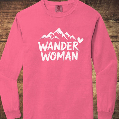 Wander Woman Comfort Colors Long-Sleeve Tee featuring a mountain design and WANDER WOMAN text, laid flat, showcasing its soft, relaxed fit.