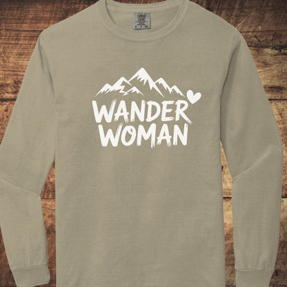 Wander Woman Comfort Colors Long-Sleeve Tee with mountain graphic and WANDER WOMAN text, showcasing softness and relaxed fit from 100% ring-spun cotton.