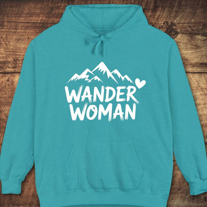 Wander Woman Comfort Colors Hoodie with mountain graphic, kangaroo pocket, and drawstring hood, offers a relaxed unisex fit for cozy, outdoor adventures.