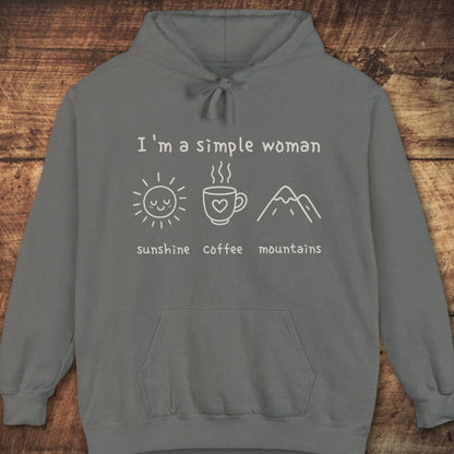 I'm A Simple Woman Comfort Colors Hoodie with 'sunshine,' 'coffee,' 'mountains' icons; soft, garment-dyed, unisex fit ideal for layering on adventures.