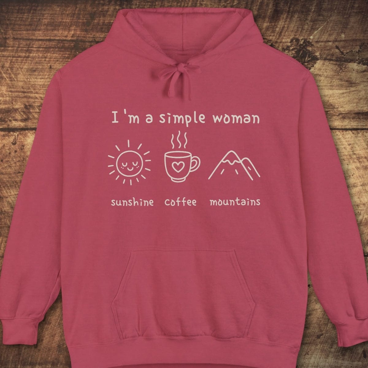 I'm A Simple Woman Comfort Colors Hoodie features a dusty-rose hue, white front print with sunshine, coffee, mountains icons, and a cozy unisex fit.