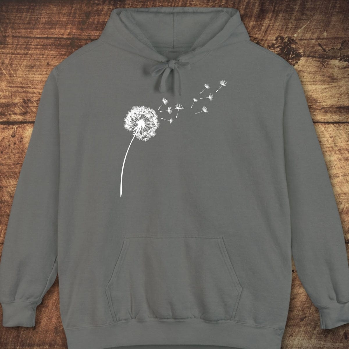 Dandelion Comfort Colors Hoodie: Slate-gray pullover with a white dandelion design, drawstring hood, and kangaroo pocket, offering a relaxed unisex fit for comfort.