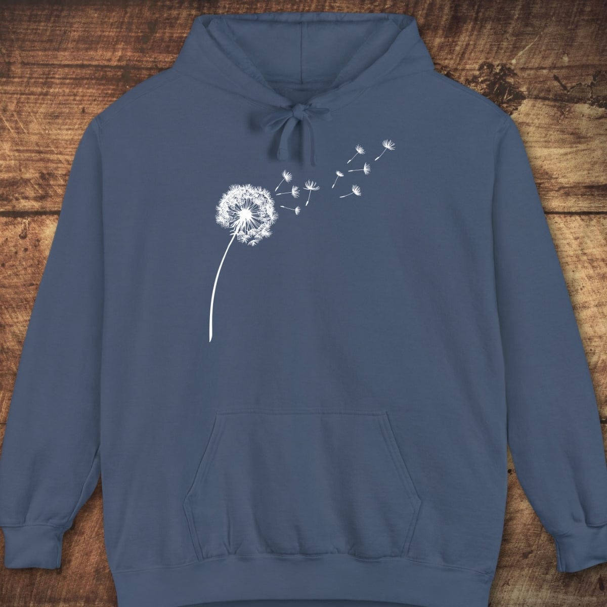 Dandelion Comfort Colors Hoodie featuring a white dandelion graphic, drawstring hood, and kangaroo pocket, perfect for layering with a relaxed unisex fit.