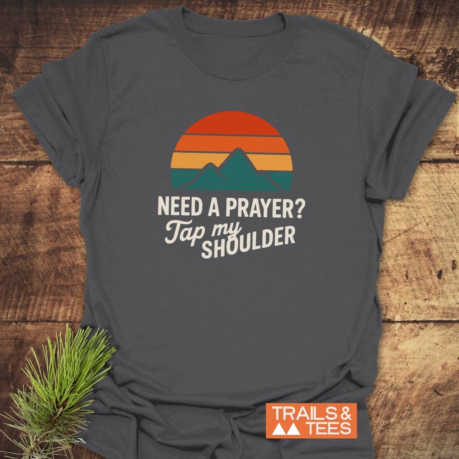Tap My Shoulder Mountain T-Shirt with retro sunset and peaks graphic, highlighting outdoor adventure spirit. Soft, durable, pre-shrunk cotton ensures comfort and lasting fit.