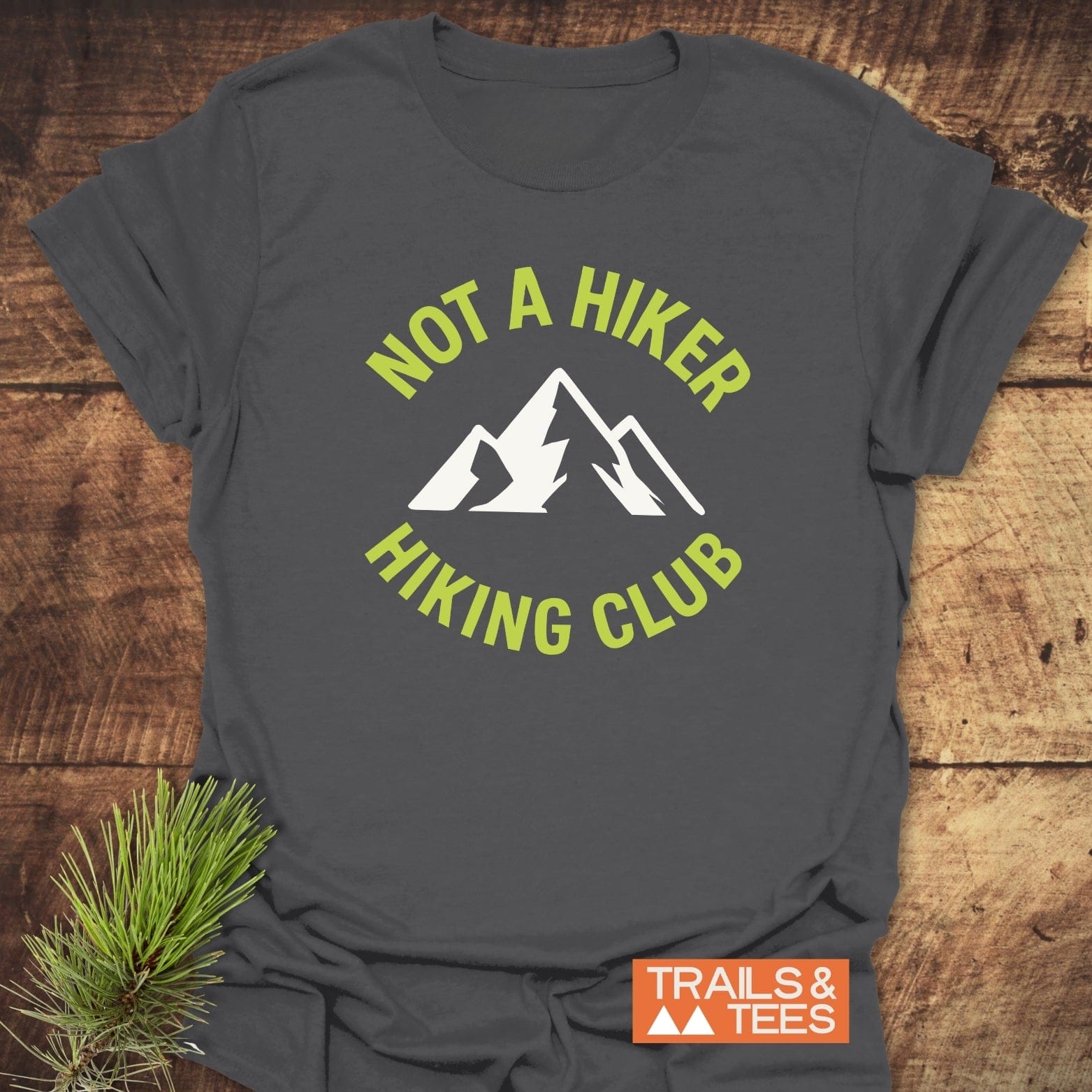 Not A Hiker T-Shirt featuring a mountain silhouette and lime-green text, made from soft ring-spun cotton with durable prints and taped shoulders for lasting shape.
