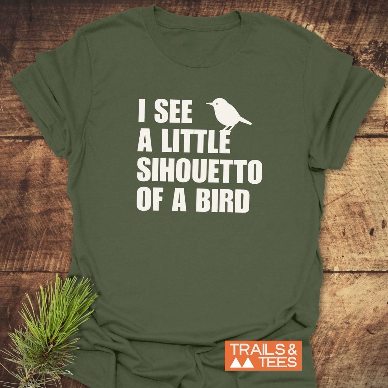 Silhouetto Of A Bird Funny T-Shirt with slogan and bird silhouette, featuring Trails & Tees logo, crafted from soft, lightweight cotton for everyday adventure.