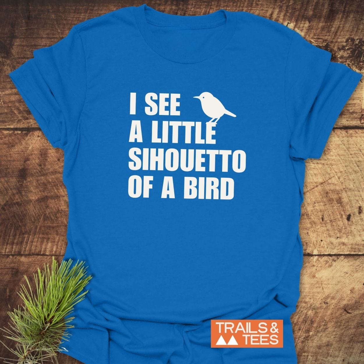 Silhouetto Of A Bird Funny T-Shirt featuring white bird silhouette and text, made from soft cotton for comfort, with Trails & Tees logo.