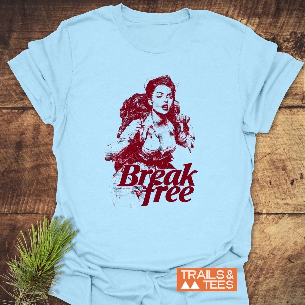 Break Free Hiking T-Shirt with vintage illustration and Break free slogan, featuring TRAILS & TEES logo; ideal for outdoor enthusiasts.