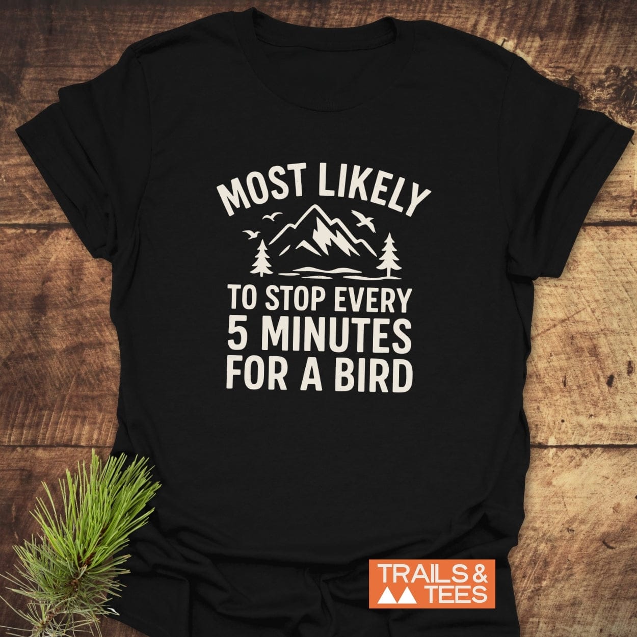 Most Likely Bird Watcher T-Shirt with mountain and bird graphic; soft ring-spun cotton, durable print, pre-shrunk for lasting shape, designed for outdoor lovers.