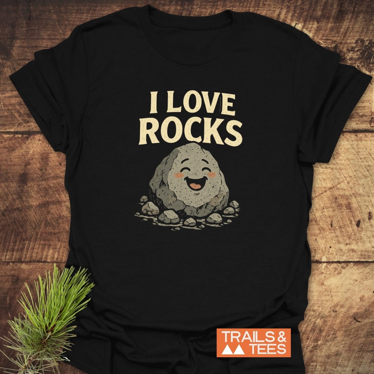 I Love Rocks T-Shirt with a smiling rock design, crafted from soft cotton. Ideal for outdoor enthusiasts, featuring durable prints and a comfortable, pre-shrunk fit.