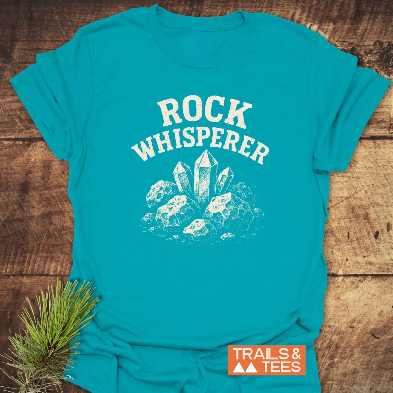 Rock Whisperer T-Shirt featuring a white stone graphic. Made from soft cotton, pre-shrunk, durable prints, perfect for outdoor adventures.