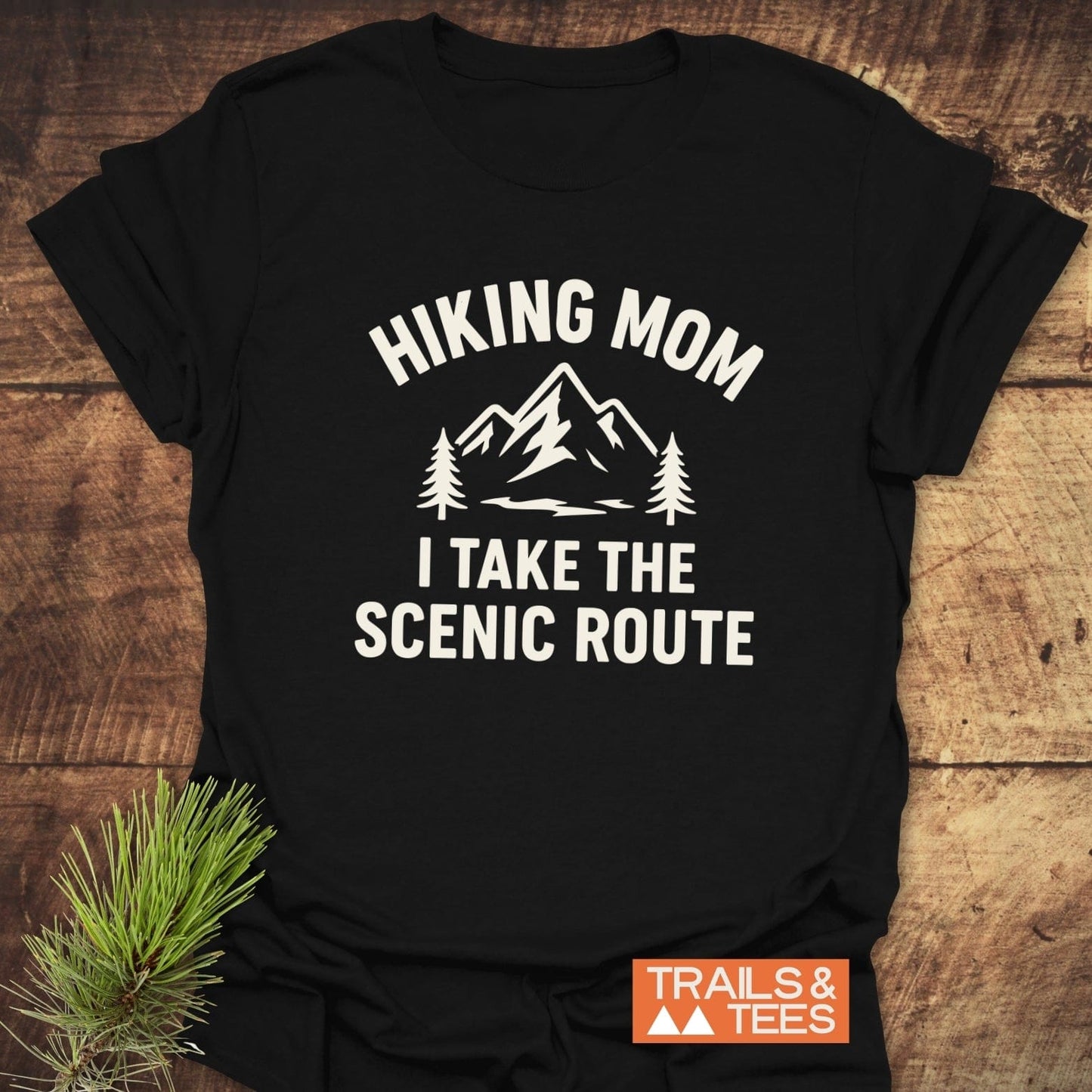 Hiking Mom, Scenic Route T-Shirt featuring mountain graphic, crafted from lightweight cotton, pre-shrunk for fit, with durable print; Trails & Tees logo visible.