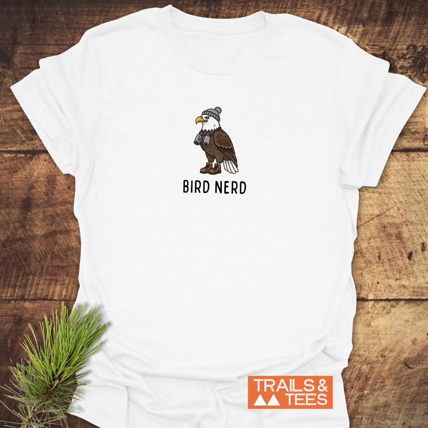 Bird Nerd Funny T-Shirt featuring a cartoon bald eagle in hiking gear, emphasizing outdoor adventure. Crafted from soft cotton, durable print, and comfortable design.