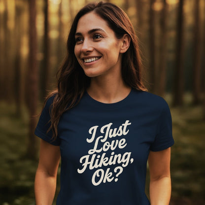 Young woman in a wooded area wearing an I Just Love Hiking T-shirt, showcasing its soft, lightweight design ideal for outdoor adventures.