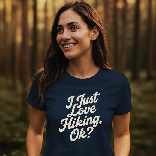 Young woman in a wooded area wearing an I Just Love Hiking T-shirt, showcasing its soft, lightweight design ideal for outdoor adventures.