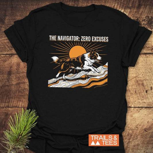 The Navigator Dog Lover T-Shirt features a herding dog on a topographic landscape with a sun, “THE NAVIGATOR: ZERO EXCUSES” text, and “TRAILS & TEES” logo, showcasing adventure-ready, outdoorsy style.