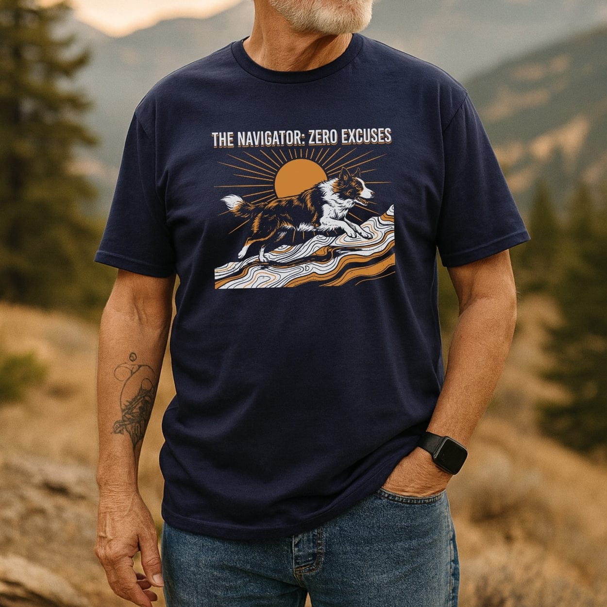 Man outdoors wearing The Navigator Dog Lover T-Shirt, featuring a dog graphic over contour lines with a sun, and the slogan “THE NAVIGATOR · ZERO EXCUSES,” paired with jeans and a smartwatch.
