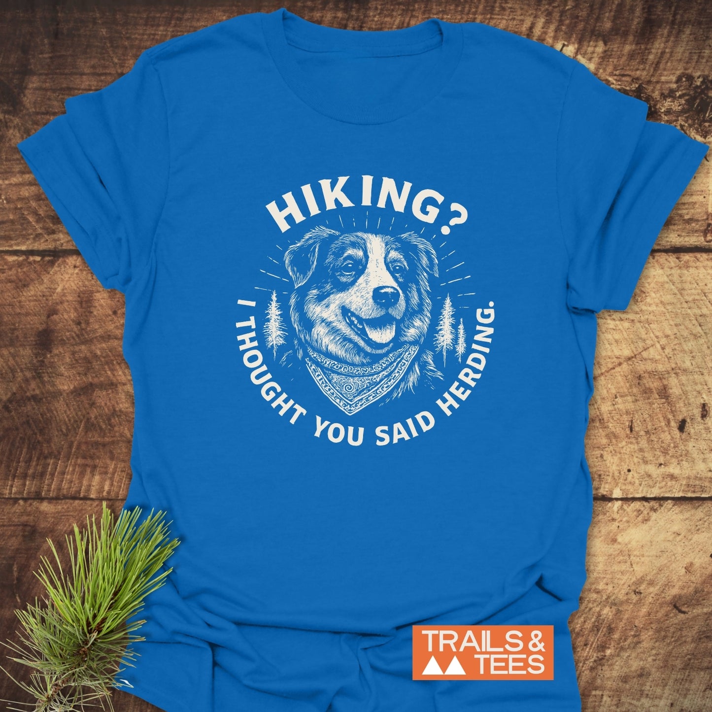 Hiking? Australian Shepherd T-Shirt featuring a happy bandana-wearing dog graphic with pine trees, crafted from soft ring-spun cotton for comfort and durability, ideal for outdoor enthusiasts.