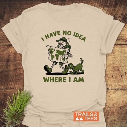 Lost Skeleton Hiker T-Shirt featuring a cartoon skeleton hiker with a map and playful dog, text I HAVE NO IDEA WHERE I AM, on soft, pre-shrunk, ring-spun cotton, perfect for outdoor adventures.