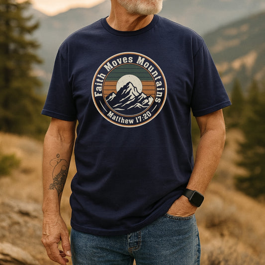Bearded man in a Faith Moves Mountains T-Shirt with mountain graphic, standing outdoors. The shirt, made of soft cotton, highlights adventure spirit and durability, perfect for nature enthusiasts.