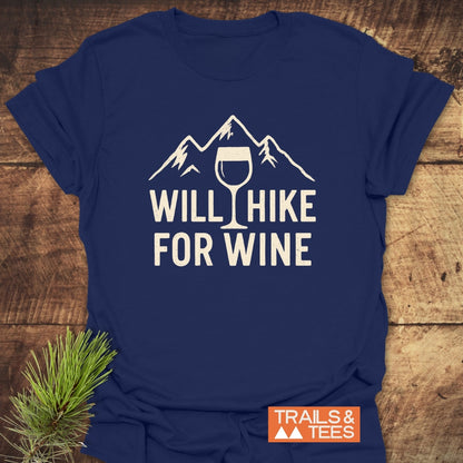 Will Hike For Wine T-Shirt featuring a stylized mountain range and wine glass design. Crafted from soft ring-spun cotton, this tee offers trail-tested comfort, perfect for outdoor enthusiasts.