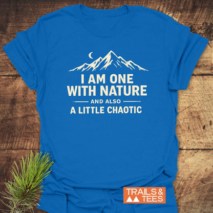 One With Nature T-Shirt featuring a mountain and moon graphic with a playful slogan. Made from soft ring-spun cotton with a small TRAILS & TEES logo near the hem.