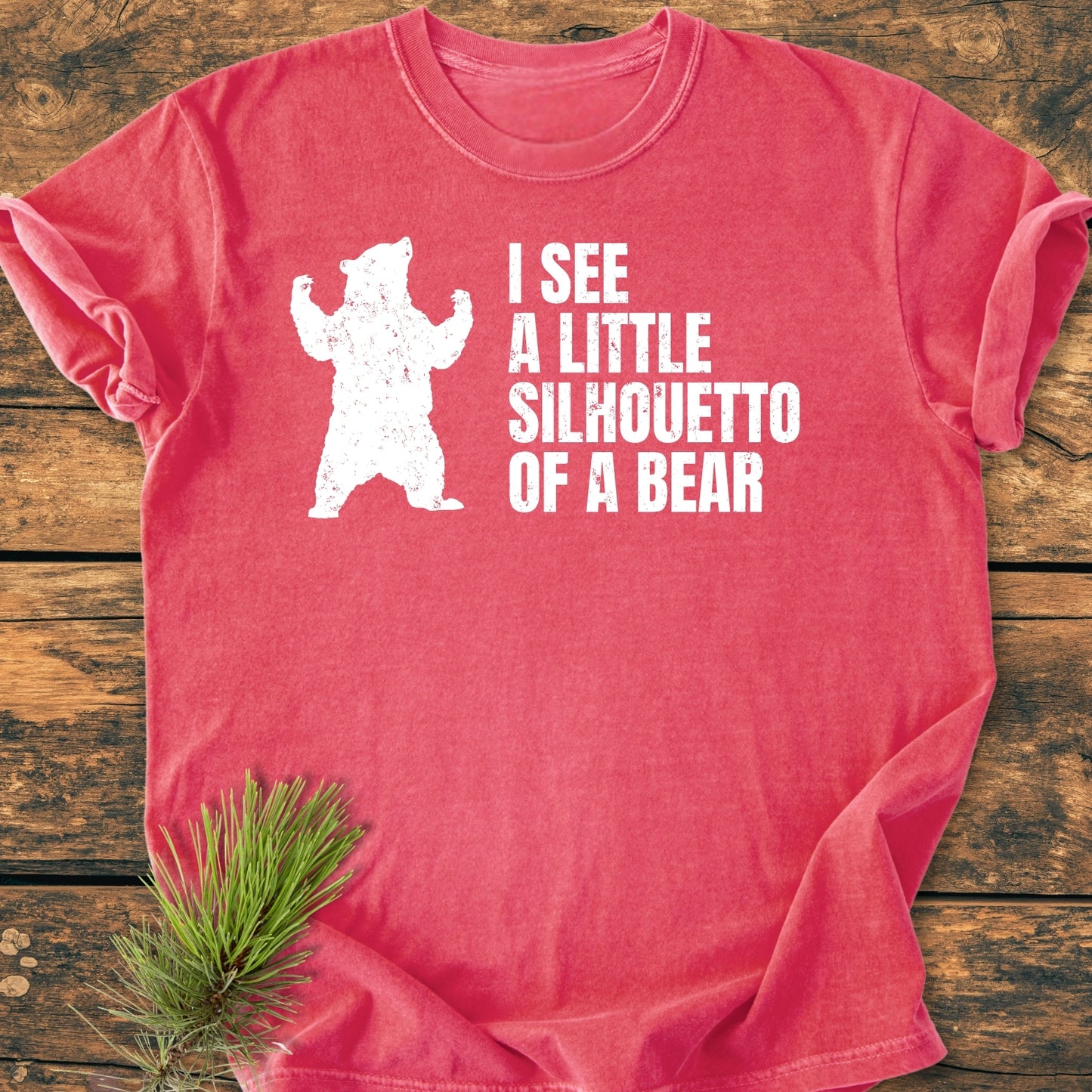 I See A Little Silhouetto Of A Bear - Vintage Wash Tee: Red T-shirt with a white bear silhouette and playful text, laid on wood, featuring soft, pre-shrunk cotton and a relaxed fit.
