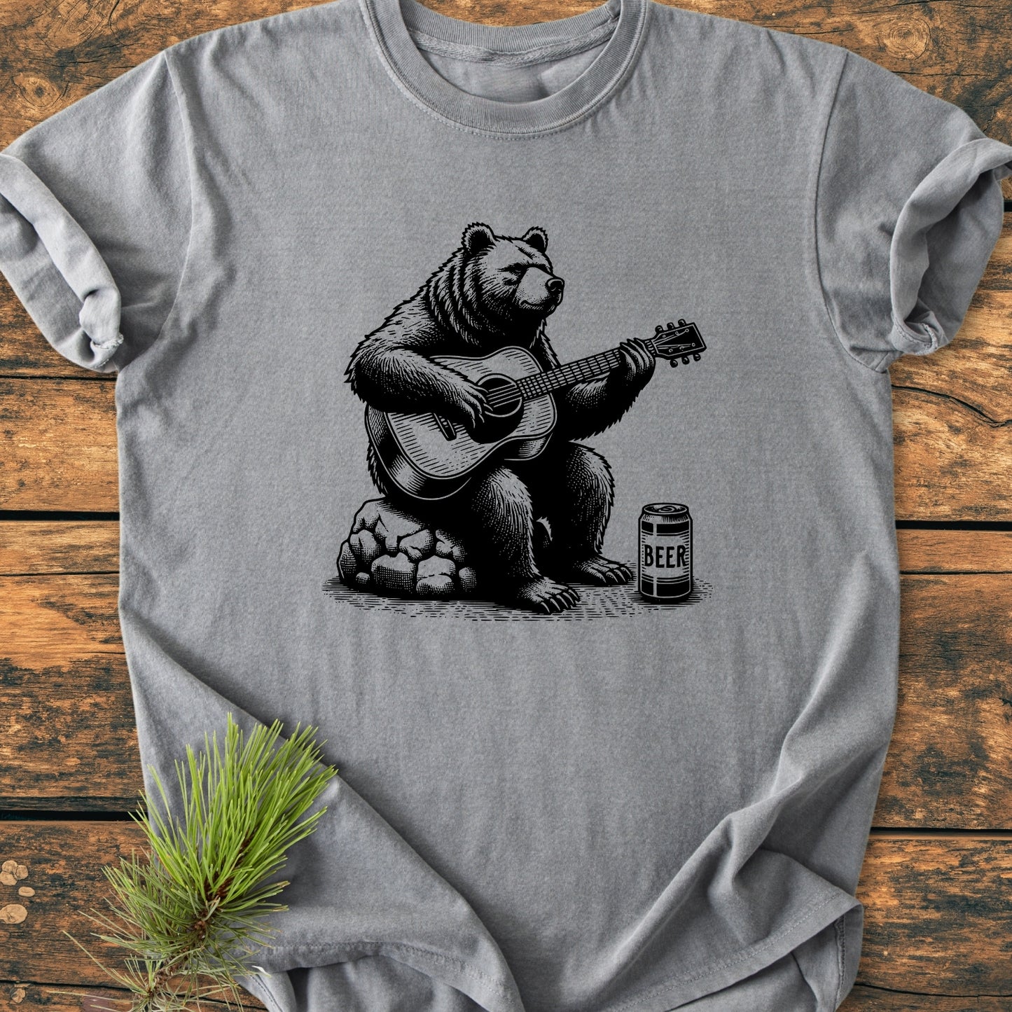 Bear Playing Guitar - Vintage Wash Tee features a black-ink illustration of a bear with a guitar and beer can, on a heather-gray background, emphasizing a relaxed, soft, durable fit.