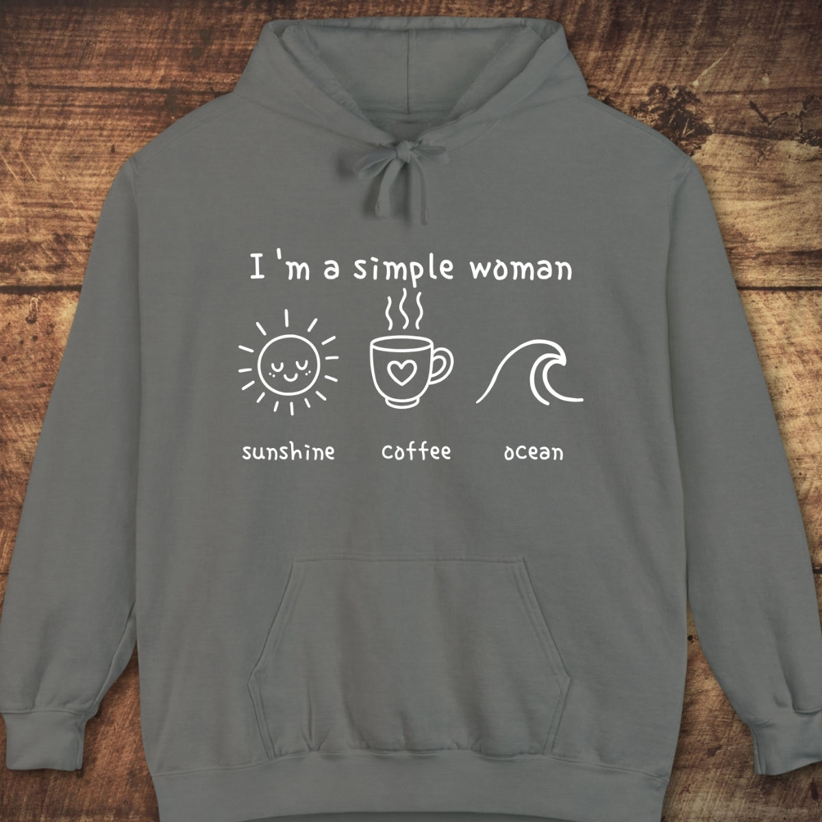 I'm A Simple Woman - Sunshine Coffee Ocean Hoodie features a relaxed fit, gray pullover design with a white print of sunshine, coffee, and ocean icons, perfect for cozy, adventurous days.