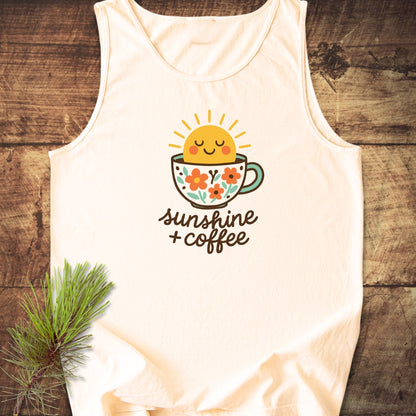 Sunshine And Coffee Tank Top featuring a playful sun in a flower-patterned mug graphic. Laid on rustic wood, this unisex, eco-friendly, cream tank offers relaxed fit, crafted from 100% ring-spun US cotton.