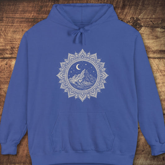 Mountain Mandala Hoodie with a white mandala graphic featuring a mountain, crescent moon, and stars on the chest. Laid flat, showcasing its relaxed fit, jersey-lined hood, and front pouch pocket.