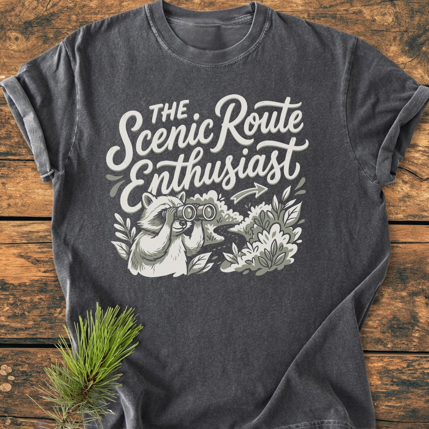 Scenic Route Raccoon - Vintage Wash Tee featuring a playful raccoon with binoculars, exploring a scenic path. Relaxed fit, pre-shrunk, 100% ring-spun cotton for everyday comfort.