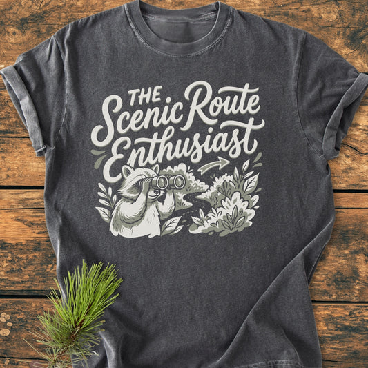 Scenic Route Raccoon - Vintage Wash Tee featuring a playful raccoon with binoculars, exploring a scenic path. Relaxed fit, pre-shrunk, 100% ring-spun cotton for everyday comfort.