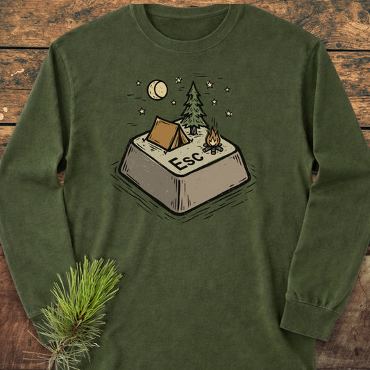 Escape Long-Sleeve Tee featuring a forest-green color with an illustrated ESC key campsite design, complete with a tent, pine tree, campfire, stars, and crescent moon, on a wooden surface.
