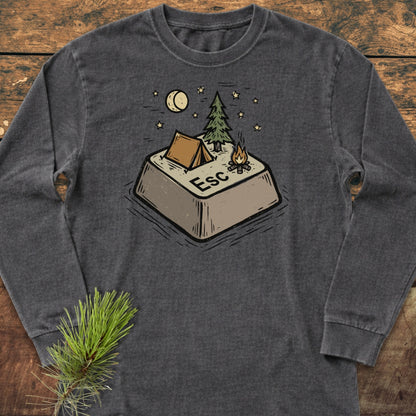 Escape Long-Sleeve Tee featuring a cozy camping graphic on a dark-gray shirt. Displayed on wood, it highlights a relaxed fit, ideal for casual comfort with a camping-inspired design.