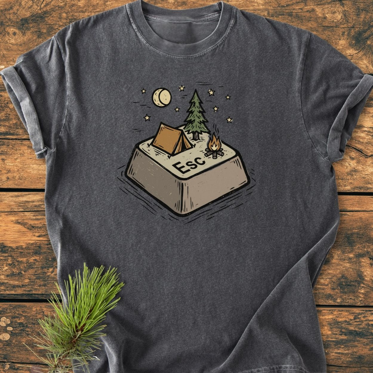 Escape - Vintage Wash Tee featuring a playful illustration of a campsite on a giant Esc key with a tent, pine tree, campfire, crescent moon, and stars, embodying outdoor adventure.