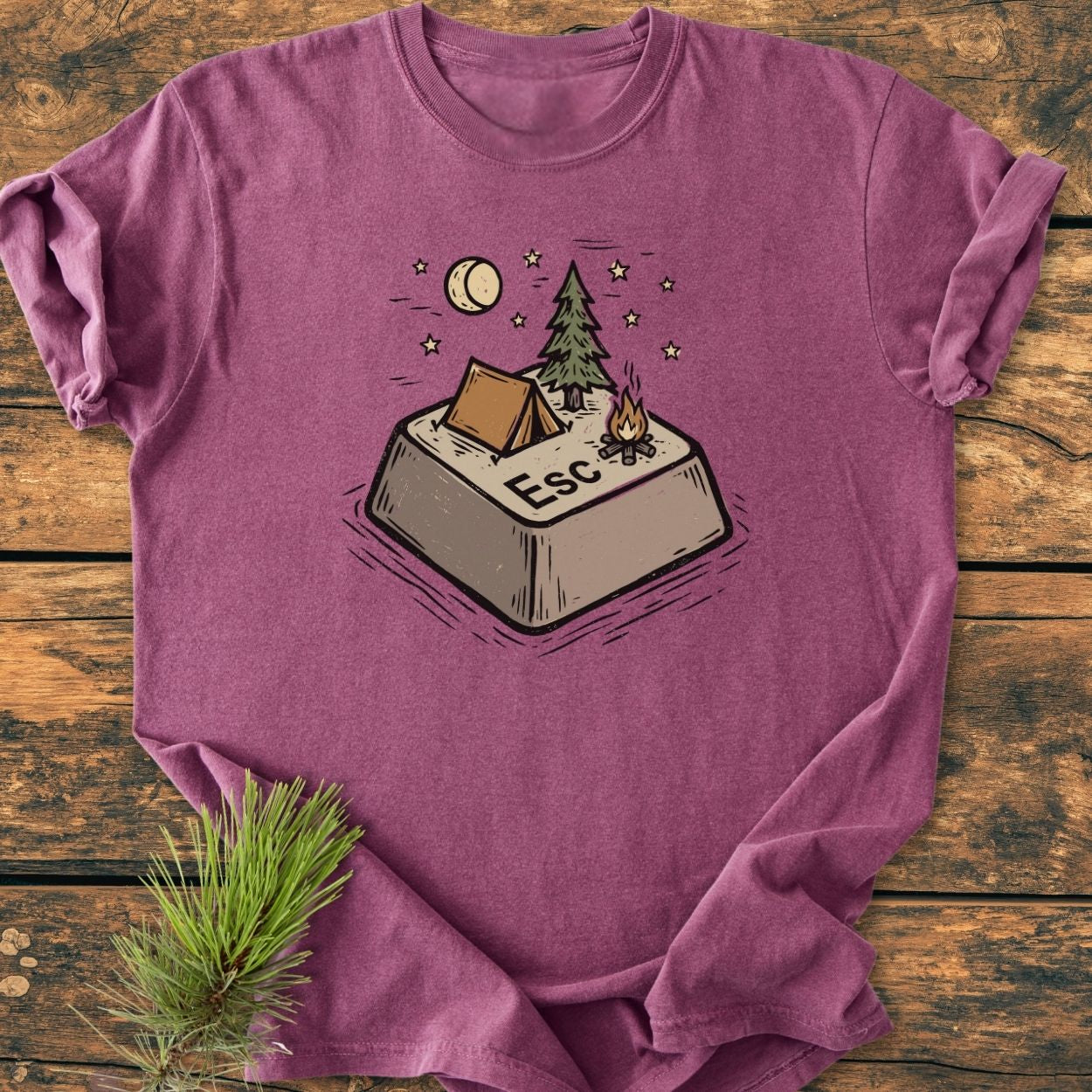Escape - Vintage Wash Tee featuring a playful campsite illustration on a giant Esc key, laid flat. Made from soft, durable 100% ring-spun cotton for a relaxed fit.