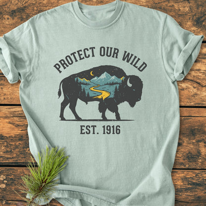 Protect Our Wild - Vintage Wash Tee features a bison silhouette with wilderness graphics on a mint-green shirt, emphasizing durability and comfort with its 100% ring-spun cotton and relaxed fit.