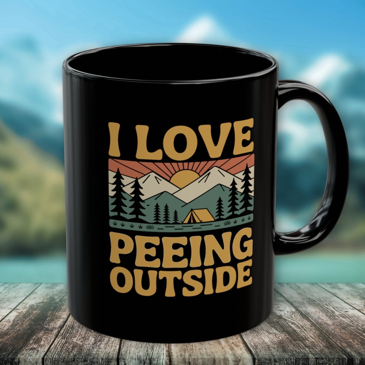 Black ceramic mug titled I Love Peeing Outside featuring a retro mountain scene with trees, sun, and tent graphic. Ideal for outdoor enthusiasts; microwave and dishwasher safe, available in 11oz and 15oz sizes.