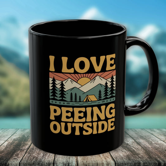 Black ceramic mug titled I Love Peeing Outside featuring a retro mountain scene with trees, sun, and tent graphic. Ideal for outdoor enthusiasts; microwave and dishwasher safe, available in 11oz and 15oz sizes.