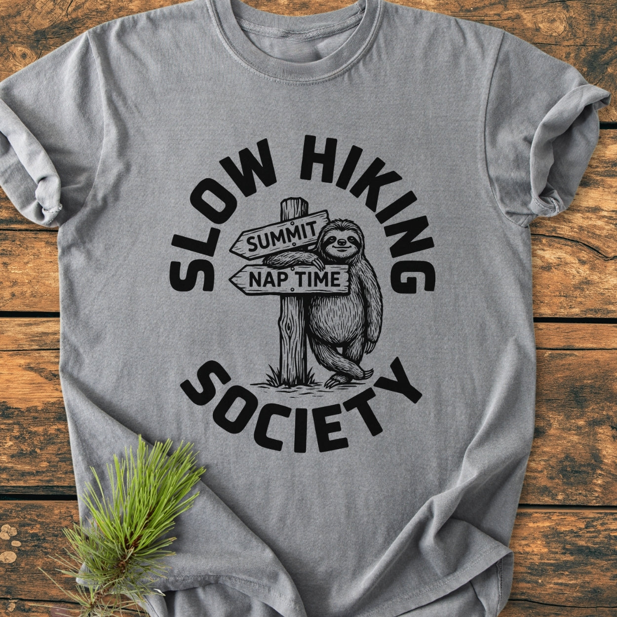 Slow Hiking Society - Vintage Wash Tee features a happy sloth graphic with Summit and Nap Time signpost, encircled by SLOW HIKING SOCIETY, on soft, garment-dyed, light-gray cotton.