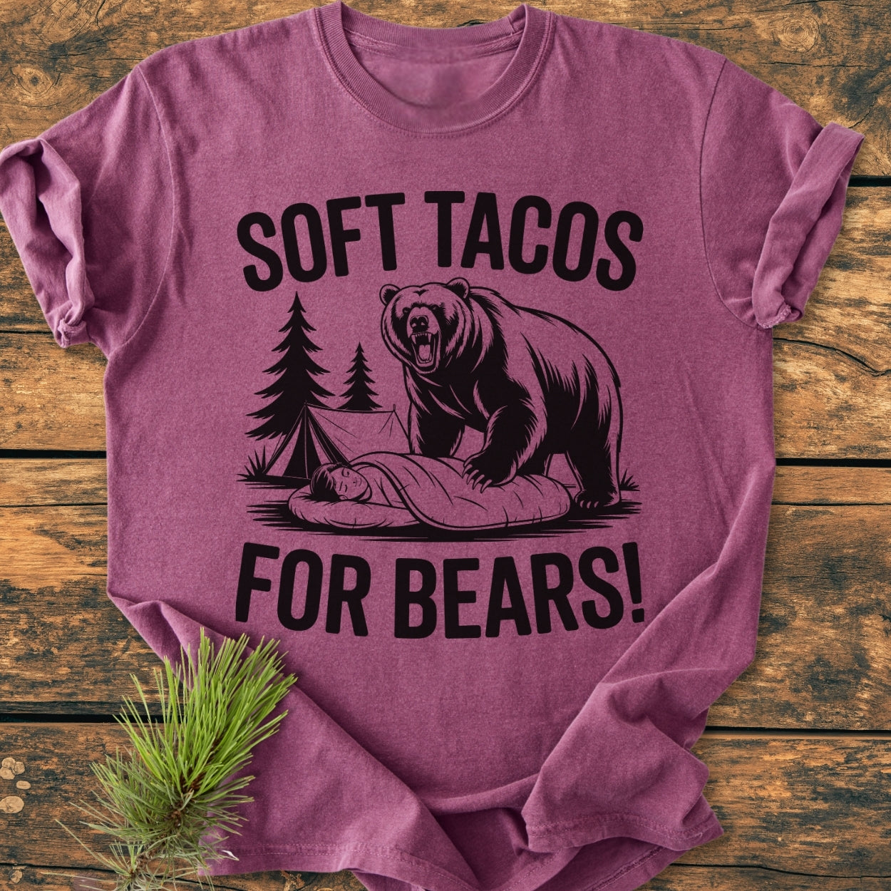 Soft Tacos For Bears - Vintage Wash Tee featuring a humorous camping scene with a bear and camper, printed on a folded, soft, garment-dyed purple T-shirt, promising comfort and durability.
