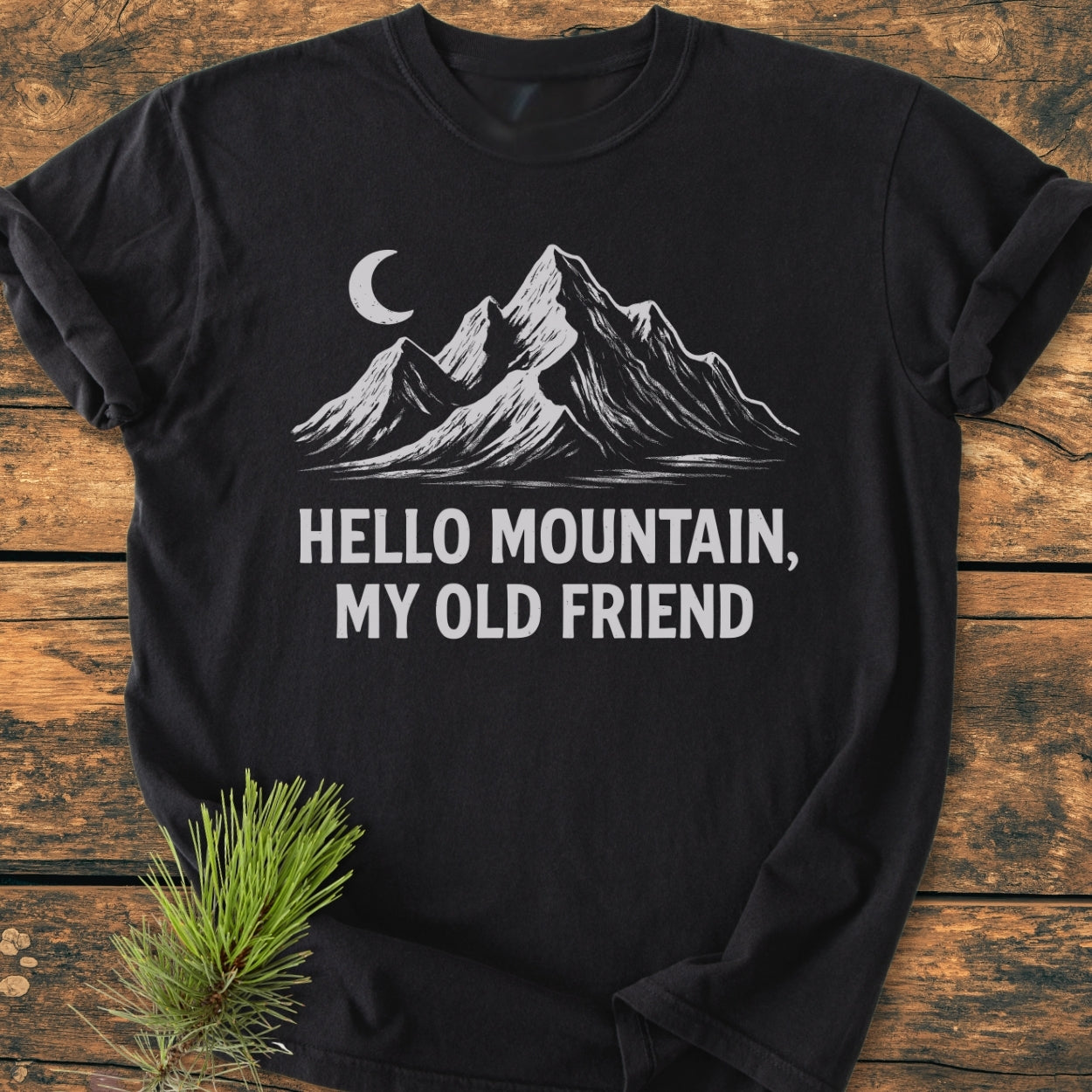 Hello Mountain My Old Friend - Vintage Wash Tee features a rugged mountain and crescent moon design on black, offering a cozy, relaxed fit with durable stitching and soft-washed, garment-dyed fabric.